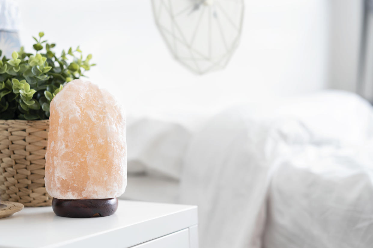 Himalayan salt lamps are said to "cleanse the air" with their gentle glow. [Photo: Getty]