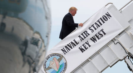 U.S. President Donald Trump boards Air Force One after visiting the Joint Interagency Task Force South (JIATF South) federal anti-smuggling and anti-drug trafficking agency in Key West, Florida, U.S. April 19, 2018. REUTERS/Kevin Lamarque