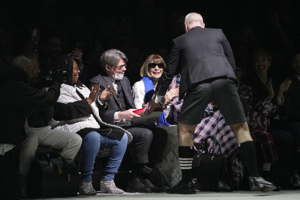 Whoopi Goldberg, left, and Anna Wintour, right, watch as designer Anna Wintour hands Andrew Bolton a heart shaped box after his collection was presented during Fashion Week, Tuesday, Feb. 14, 2023, in New York. (AP Photo/Mary Altaffer)