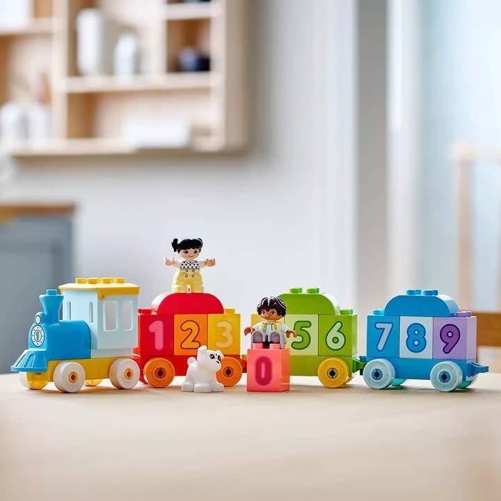 Colorful Duplo number train toy with figures and dog toy