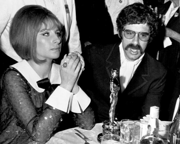 Actor Elliot Gould and his singer-actress wife Barbra Streisand attend the Academy Awards Ceremony, April 1969, in Hollywood. Barbra won an Oscar for her part in the film 'Funny Girl'. (AP Photo)