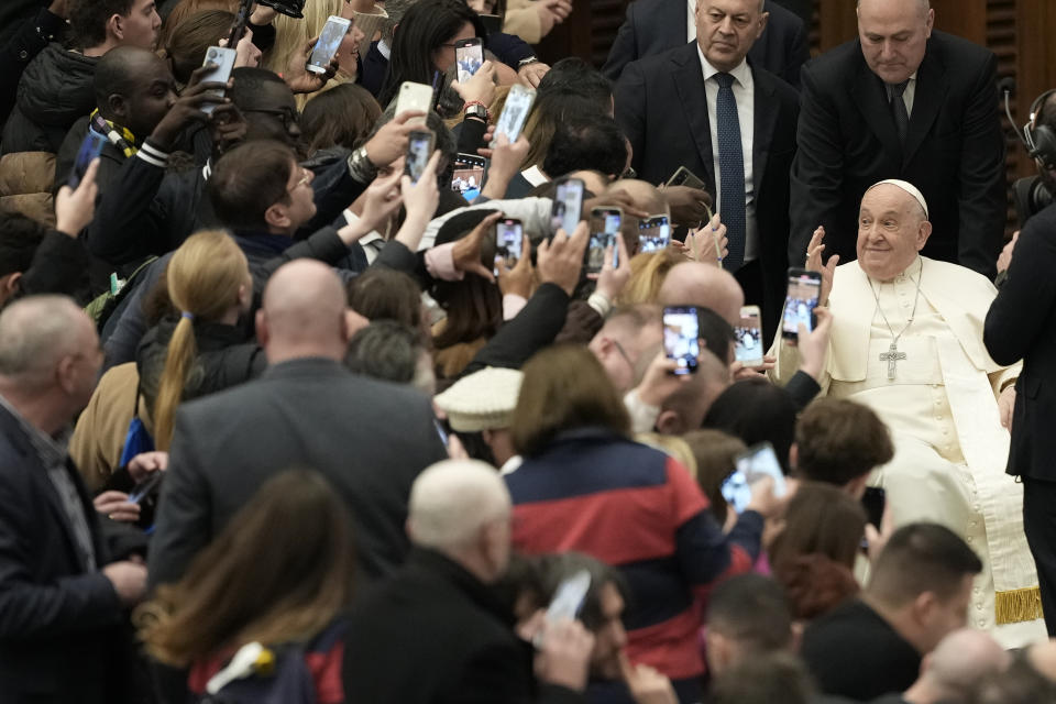 Pope Francis greets faithful during his weekly general audience in the Pope Paul VI hall at the Vatican, Wednesday, Jan. 31, 2024. (AP Photo/Andrew Medichini)