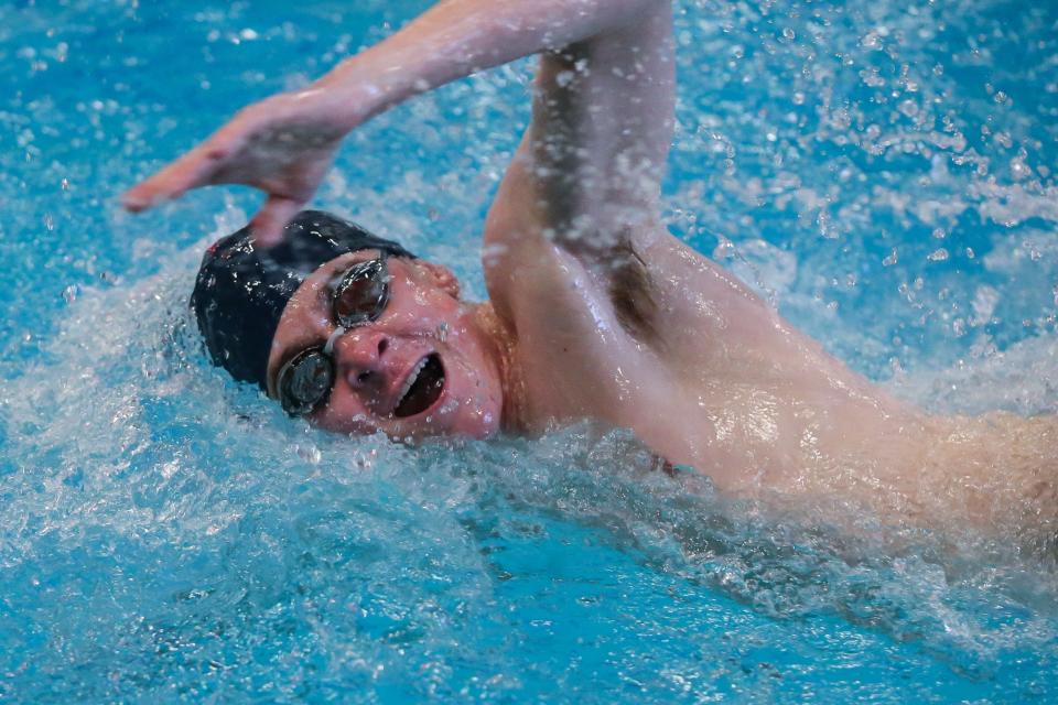 Framingham’s Brendan Tracy competes int he 100-yard Freestyle during the swim meet against Natick at Keefe Tech in Framingham on Jan. 21, 2022.