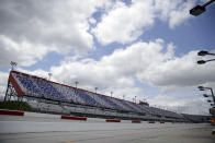 The grandstands in Darlington Raceway sit empty before the start of the NASCAR Cup Series auto race Sunday, May 17, 2020, in Darlington, S.C. (AP Photo/Brynn Anderson)