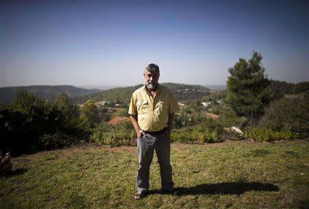 Retired Israeli spy Mishka Ben-David poses for a picture at his home in Ramat Raziel near Jerusalem October 22, 2013. REUTERS/Ronen Zvulun