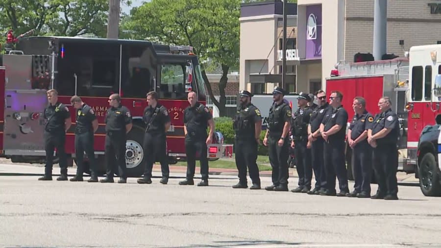 Officers line the street for funeral procession.