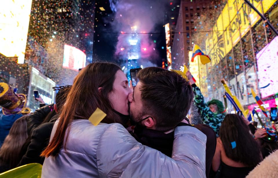 January 1, 2022: Irene Mayoral, left and Gerald Nuell, of Spain, kiss as they celebrate in Times Square in New York shortly after midnight as they attend New Year's Eve celebrations. The couple became engaged Friday.
