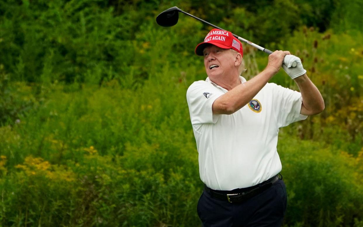 Donald Trump playing golf