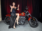 <p>The <em>America’s Got Talent</em> judge always seems to find the perfect accessory to pose with — like this hot motorcycle at the amfAR Gala on Wednesday. (Photo: Dimitrios Kambouris/amfAR/Getty Images) </p>