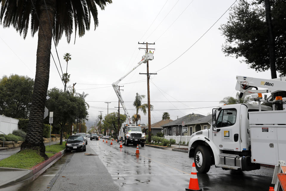 Edison crews work to restore power lines along West Figueroa Street in Santa Barbara, Calif., Wednesday, March 6, 2019. A downpour rolled into California with spectacular lightning and thunderclaps Tuesday night in one of the most electric storm systems of the winter. The storm was the latest atmospheric river to flow into California this winter. The National Weather Service reported "copious" lightning strikes as the long plume of Pacific moisture approached the coast on Tuesday. (AP Photo/Daniel Dreifuss)