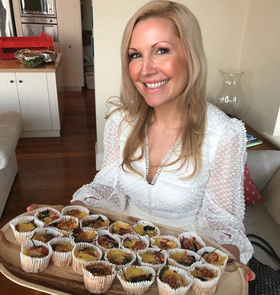 Rhian Allen poses with Healthy Mummy snacks from the nutrition plan for new mums