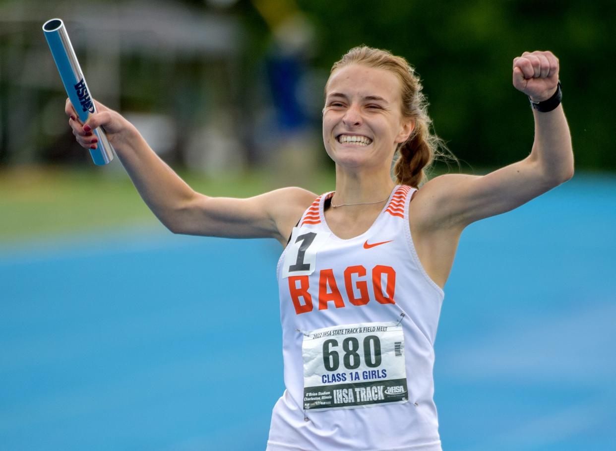 Winnebago's Grace Erb celebrates after crossing the finish line in first place as the anchor leg of their 4X800-meter relay during the Class 1A State Track and Field Championships on Saturday, May 21, 2022 at Eastern Illinois University.