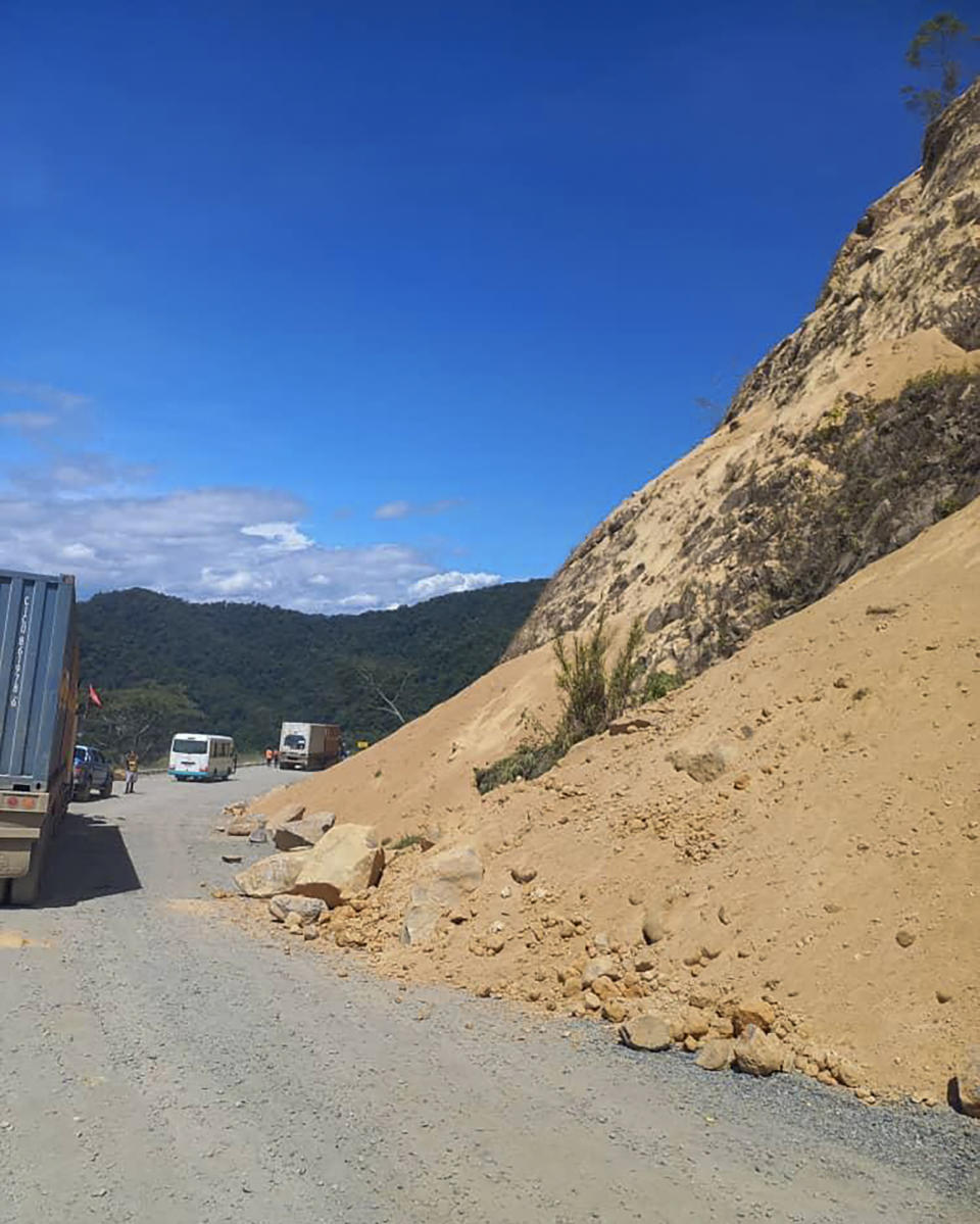 Debris lies strewn across a highway following a landslide near the town of Kainantu, following a 7.6-magnitude earthquake in northeastern Papua New Guinea, Sunday, Sept. 11, 2022. The quake hit at 9:46 a.m. local time, with the epicenter 67 kilometers (42 miles) east of Kainantu, a sparsely populated area. (Renagi Ravu via AP)