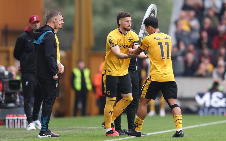 Hwang Hee-Chan of Wolverhampton Wanderers interacts with Matt Doherty