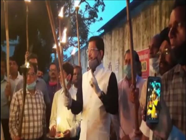 Uttarakhand Congress leader Suryakant Dhasmana during a torch rally in Dehradun on Friday. (Photo/ANI)