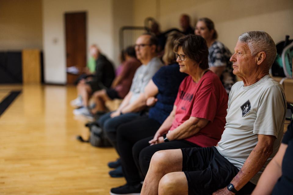 Pickleball players enjoy watching the games and making friends on the sidelines.