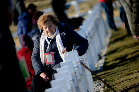 A relative of an Argentine soldier who died during the Falklands War reacts during her visit to Darwin cemetery, in the Falkland Islands, March 26, 2018. Argentine Presidency/Handout via REUTERS