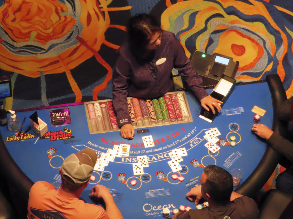 A dealer conducts a card game at the Ocean Casino Resort in Atlantic City, N.J., on Dec. 2, 2022. The city's two newest casinos - Hard Rock and Ocean - which both opened on June 27, 2018, have become the second and third most successful Atlantic City casinos in terms of money won from in-person gamblers. (AP Photo/Wayne Parry)