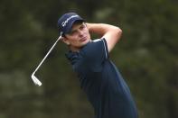 Justin Rose of England watches his tee shot on the 10th hole during the first round of the U.S. Open Championship golf tournament in Pinehurst, North Carolina, June 12, 2014. REUTERS/Mike Segar