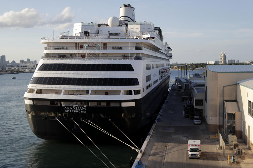 An ambulance leaves as Carnival's Holland America cruise ship Zaandam is docked at Port Everglades during the coronavirus pandemic, Thursday, April 2, 2020, in Fort Lauderdale, Fla. Those passengers who are fit for travel in accordance with guidelines from the U.S. Centers for Disease Control will be permitted to disembark. (AP Photo/Lynne Sladky)