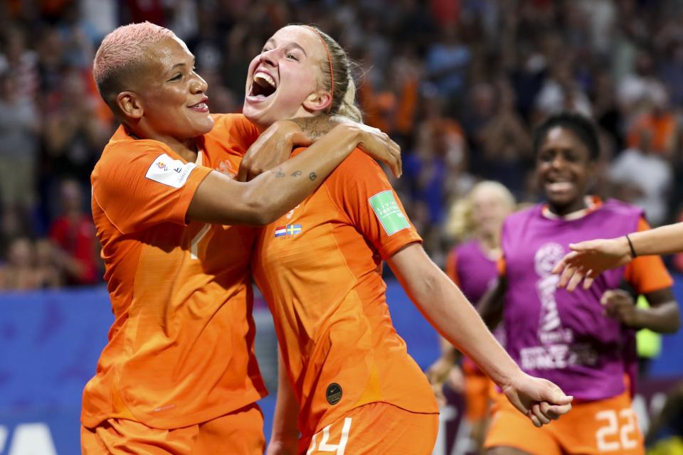 Netherlands' Jackie Groenen, is congratulated by teammate Shanice Van De Sanden, left, after scoring during the Women's World Cup semifinal soccer match between the Netherlands and Sweden, at the Stade de Lyon outside Lyon, France, Wednesday, July 3, 2019. (AP Photo/Francisco Seco)