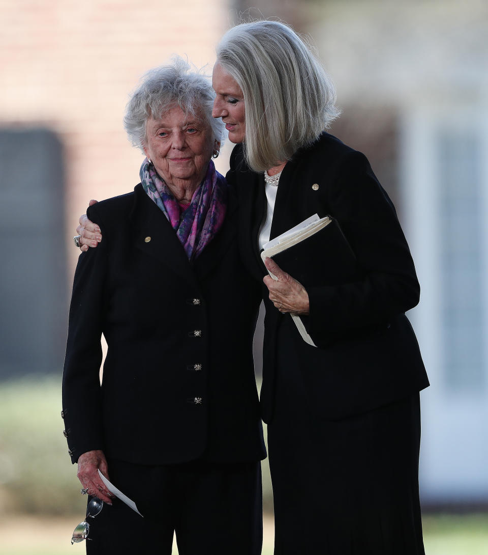 <p>Sisters of Billy Graham, Jean Ford and Virginia Graham embrace during a funeral service at the Billy Graham Library for the Rev. Billy Graham, who died last week at age 99, Friday, March 2, 2018, in Charlotte, N.C. (Photo: John Bazemore/AP) </p>