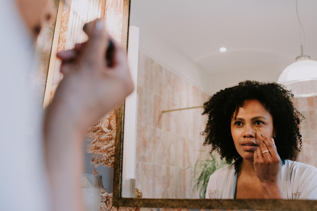 While some might think they're the same issue, eye bags and dark circles can occur at the same time. (Photo via Getty Images)