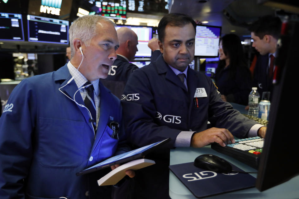 TraderTimothy Nick, left, and specialist Dilip Patel work on the floor of the New York Stock Exchange, Tuesday, June 11, 2019. Stocks are rising early Tuesday as Wall Street continues to thrive in June. (AP Photo/Richard Drew)