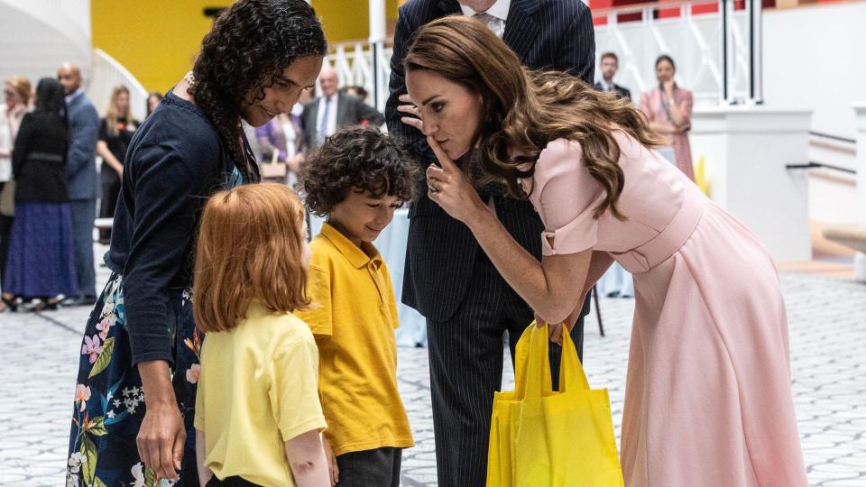 Princess Kate is given a goodie bag for her children as she officially opens The Young V&A