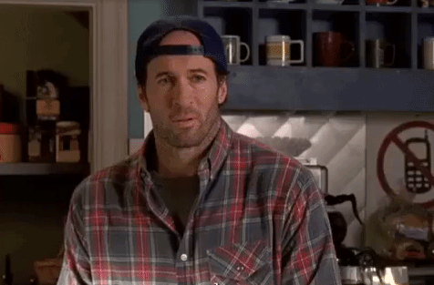 a characters wearing a flannel and backwards cap