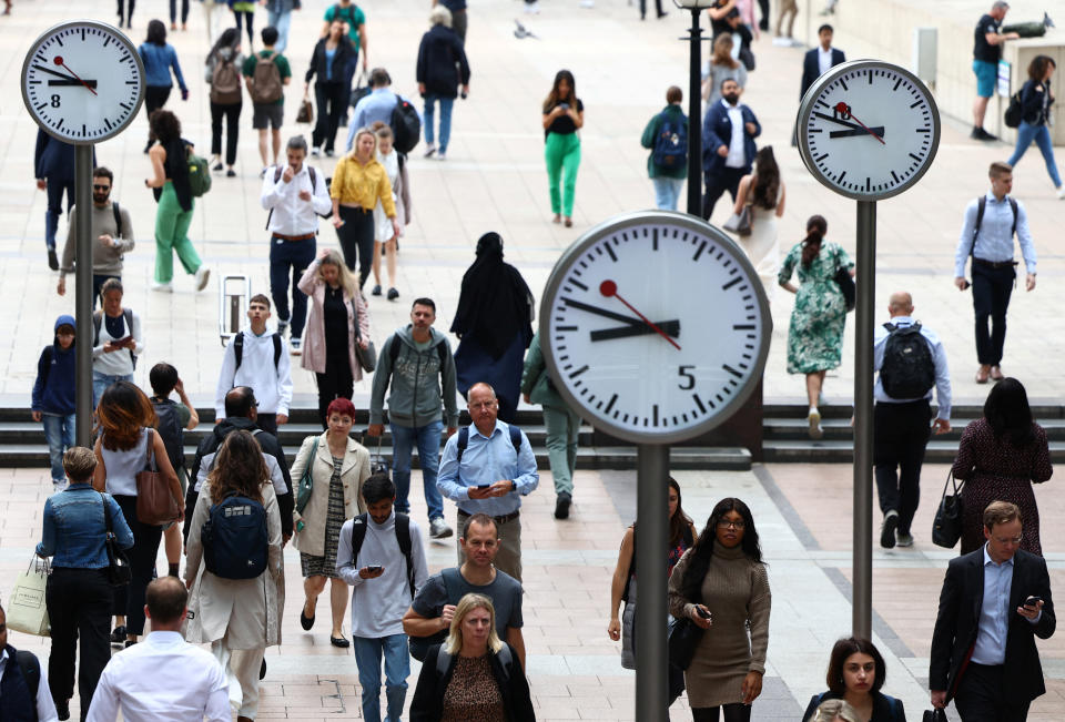 Workers walk through the Canary Wharf financial district, ahead of a Bank of England decision on interest rate changes, in London, Britain, August 3, 2023. REUTERS/Toby Melville UK economy