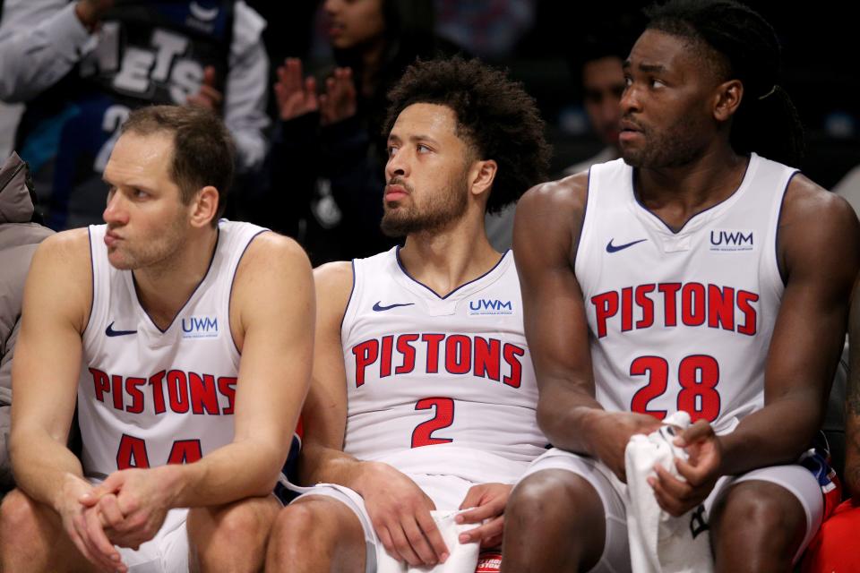 Detroit Pistons forward Bojan Bogdanovic (44) and guard Cade Cunningham (2) and center Isaiah Stewart (28) watch from the bench during the fourth quarter of a loss to the Brooklyn Nets at Barclays Center.