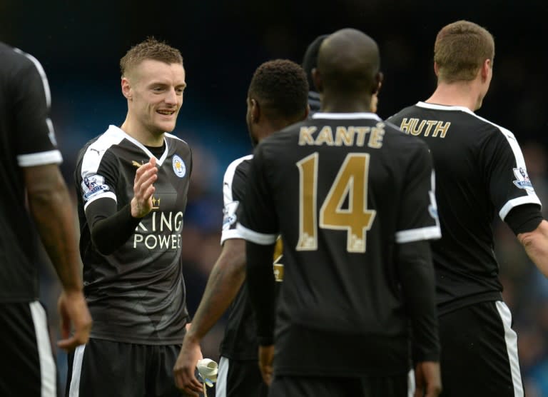 Striker Jamie Vardy (L) is adamant Leicester City remain unfazed by the mounting pressure of the title race as the shock leaders prepare for a summit meeting with Arsenal on Sunday