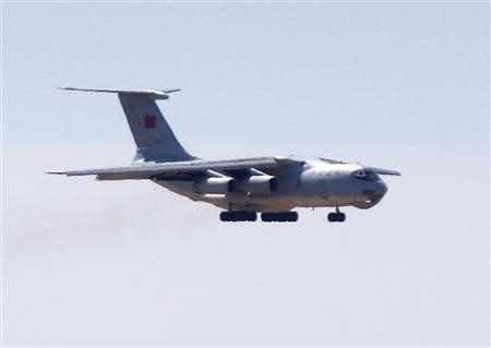 A Chinese Air Force Ilyushin Il-76 aircraft used in the search for Malaysia Airlines Flight MH370 prepares to land at Perth International Airport, March 27, 2014. REUTERS/Jason Reed