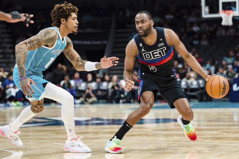 Charlotte Hornets guard Kelly Oubre Jr. (12) guards against Detroit Pistons guard Alec Burks (5) during the first half of an NBA basketball game in Charlotte, N.C., Monday, Feb. 27, 2023. (AP Photo/Jacob Kupferman)