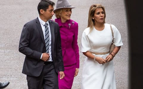 Princess Haya Bint al-Hussein ( wearing white), arrives at the High Court in London this week with lawyer Baroness Shackleton - Credit: i-Images