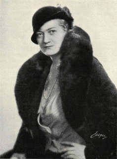 Black and white picture of a woman in a fur coat.