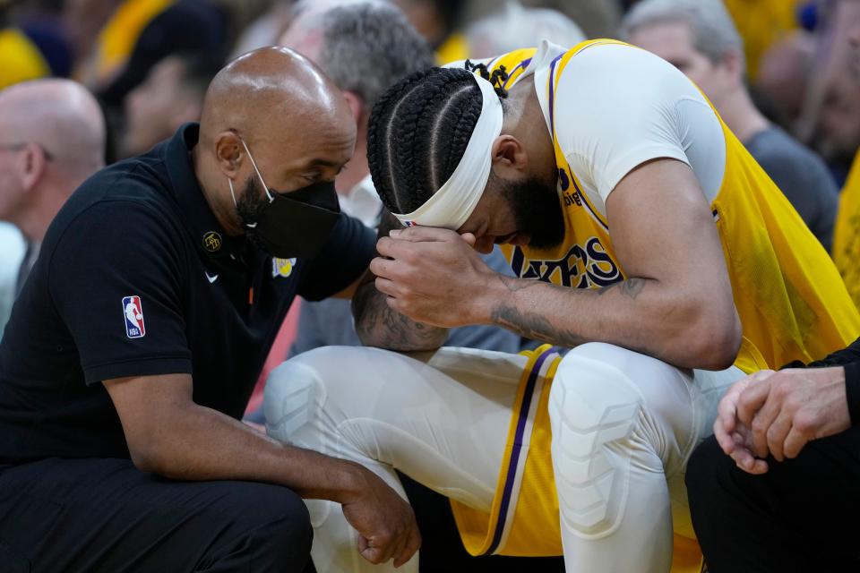 Anthony Davis sits on the bench after he was hit in the head in Game 5.