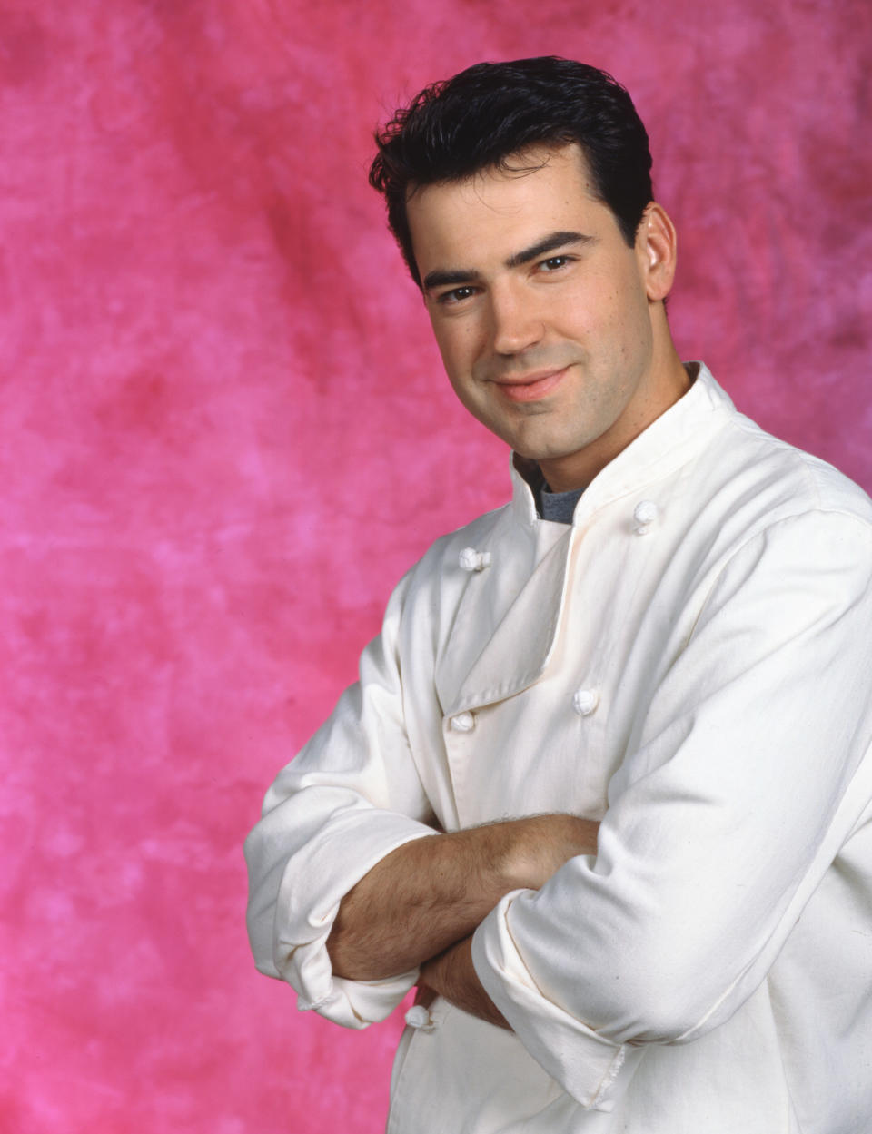 Ron Livingston smiling in a chef's jacket in a soap opera photo