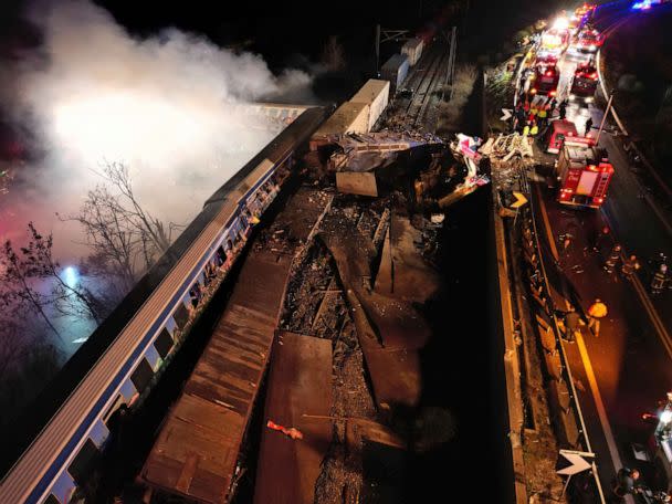 PHOTO: Smoke rises from trains as firefighters and rescuers operate after a collision near Larissa city, Greece, on March 1, 2023. (Vaggelis Kousioras/AP)
