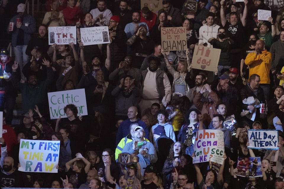 FILE - Wrestling fans during the WWE Monday Night RAW event, Monday, March 6, 2023, in Boston. WWE's sponsorship revenue for SummerSlam, Saturday, Aug. 5, 2023, rose 23% from a year ago to $7 million, the most for any event outside of WrestleMania. (AP Photo/Charles Krupa, File)