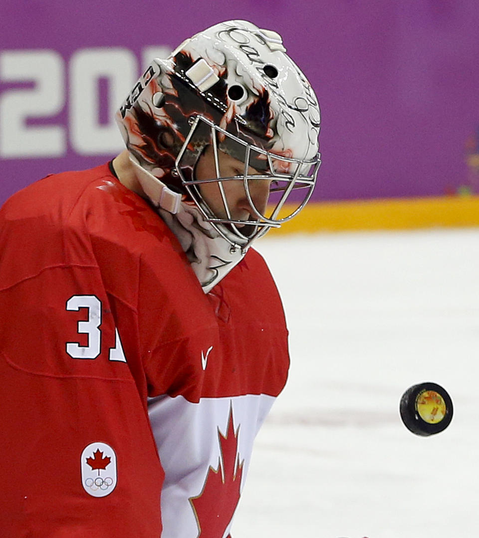 Canada goaltender Carey Price blocks a shot by Sweden during the first period of the men's gold medal ice hockey game at the 2014 Winter Olympics, Sunday, Feb. 23, 2014, in Sochi, Russia. (AP Photo/Julio Cortez)