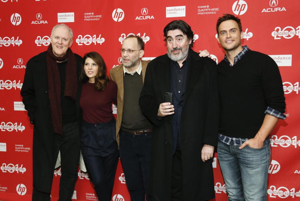 Writer and director Ira Sachs, third left, poses with cast members from left to right, John Lithgow, Marisa Tomei, Alfred Molina and Cheyenne Jackson as Molina takes a photo of photographers with his mobile phone at the premiere of the film "Love is Strange" during the 2014 Sundance Film Festival, on Saturday, Jan. 18, 2014 in Park City, Utah. (Photo by Danny Moloshok/Invision/AP)