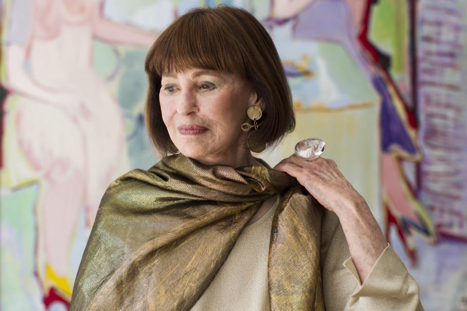 Fashion designer and artist Gloria Vanderbilt poses for a photo in Toronto's De Luca Fine Art Gallery at the launch of her first solo art show in Canada. on June 14, 2013. The intrepid heiress who began her extraordinary life as the "poor little rich girl" of the Great Depression, and survived family tragedy, multiple marriages and reigned during the 1970s and '80s as a designer jeans pioneer, died on June 17. she was 95. (AP Photo/The Canadian Press, Chris Young)