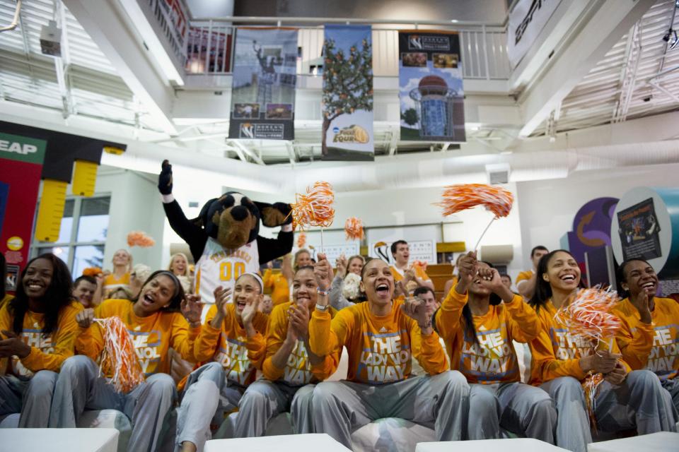 Tennessee players from left, Jasmine Jones, Jannah Tucker, Meighan Simmons, Andraya Carter, Cierra Burdick, Jordan Reynolds, Isabelle Harrison and Ariel Massengale celebrate as they receive a No. 1 Seed in the NCAA college basketball tournament in Knoxville, Tenn., Monday, March 17, 2014. Players, coaches, and fans gathered for the selection show at the Women's Basketball Hall of Fame. (AP Photo/The Knoxville News Sentinel, Saul Young)