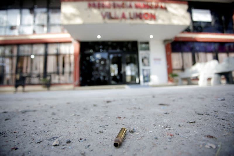 FILE PHOTO: A spent bullet shell casing is pictured near the facade of the bullet-riddled town hall of Villa Union, days after a gun battle between police and hitmen, in the municipality of Villa Union, Coahuila