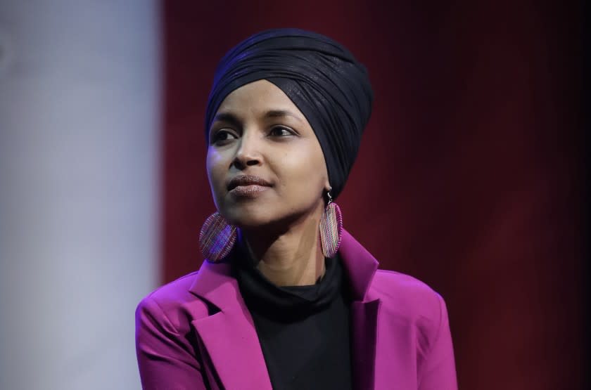 FILE - In this Jan. 31, 2020, file photo, Rep. Ilhan Omar, D-Minn., participates in a panel during a campaign event for Democratic presidential candidate Sen. Bernie Sanders in Clive, Iowa. Omar on Monday, June 15, announced the death of her father due to complications from COVID-19. In a statement, Omar said Nur Omar Mohamed died Monday. She gave no additional information. (AP Photo/Marcio Jose Sanchez, File)