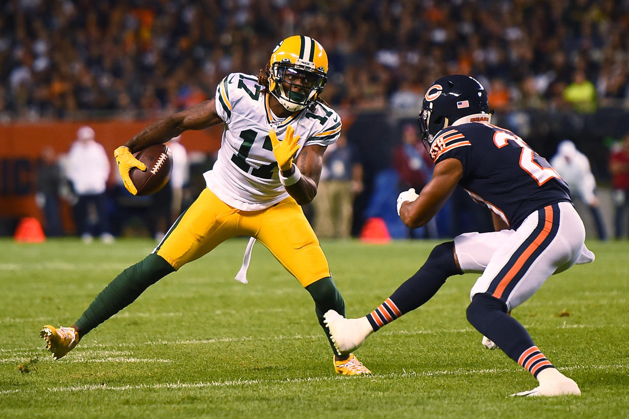 CHICAGO, ILLINOIS - SEPTEMBER 05:  Davante Adams #17 of the Green Bay Packers avoids a tackle by Kyle Fuller #23 of the Chicago Bears during a game at Soldier Field on September 05, 2019 in Chicago, Illinois. (Photo by Stacy Revere/Getty Images)