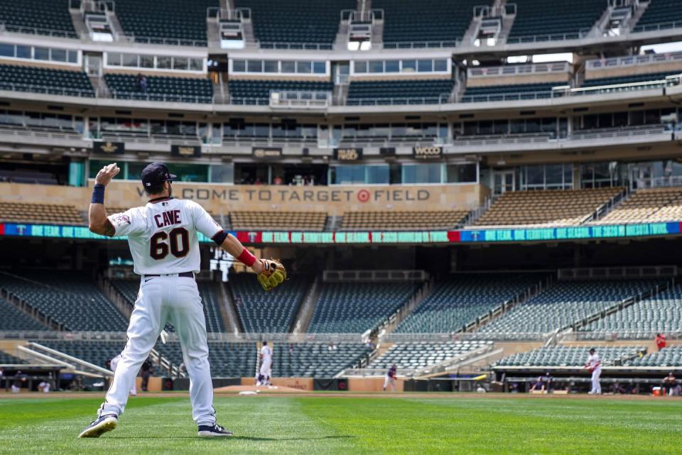<p>Jake Cave #60 of the Minnesota Twins throws during an intrasquad game on July 20 at Target Field in Minneapolis.</p>