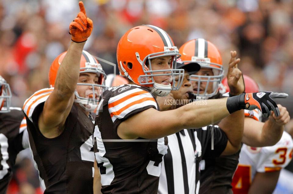 Cleveland Browns linebacker Jason Trusnik, center, and cornerback Raymond Ventrone, left, try point out a turnover to the referees in a game against the Kansas City Chiefs on Sept. 19, 2010, in Cleveland.